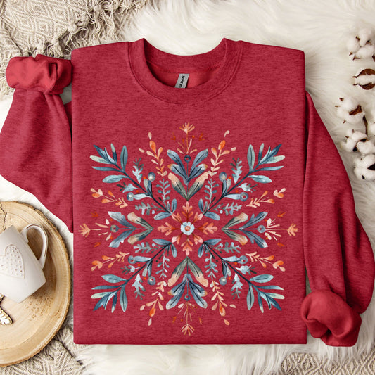 Antique Cherry Red Gildan fleece sweatshirt with a watercolor Nordic snowflake design.