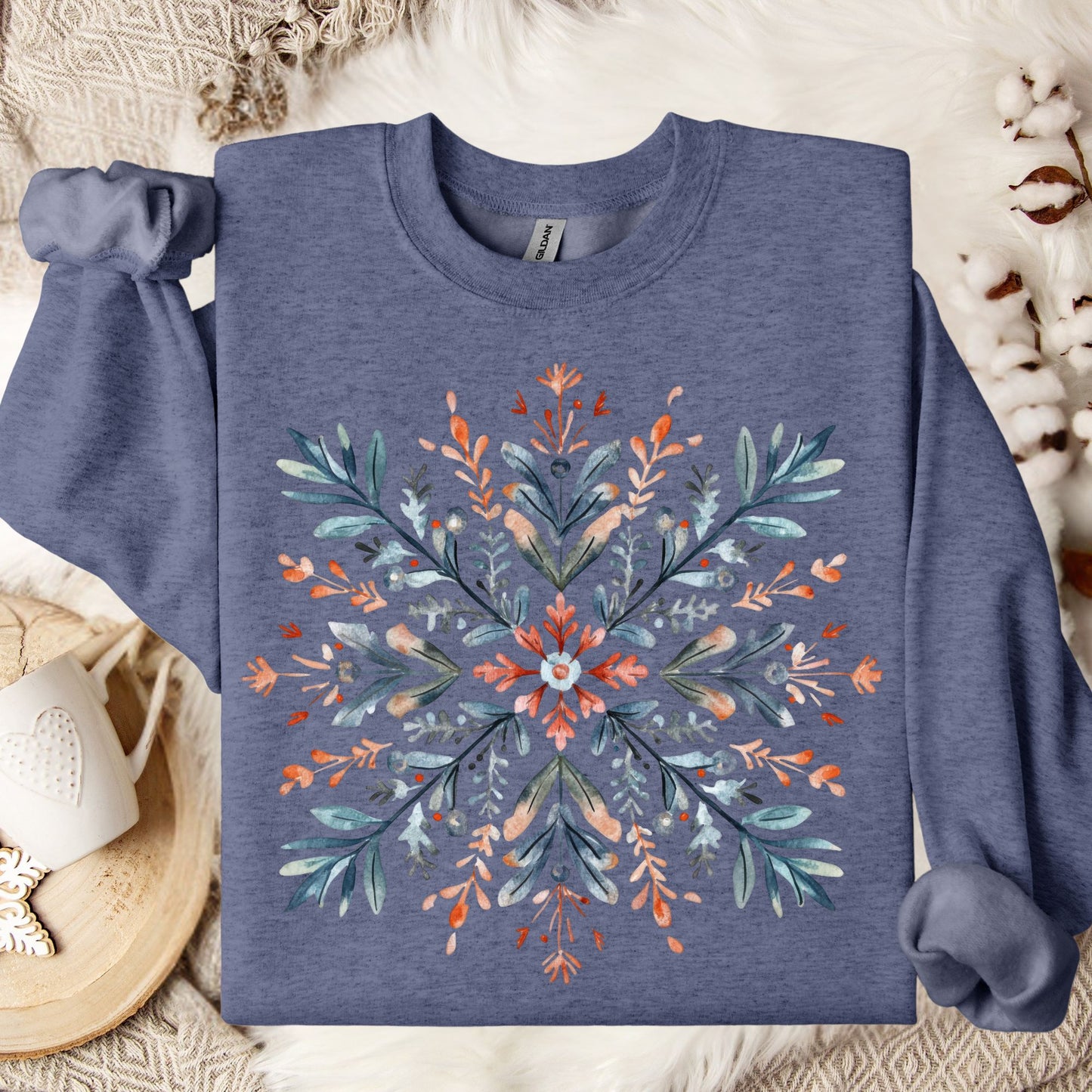 Heather Sport Dark Navy Gildan fleece sweatshirt with a watercolor Nordic snowflake design in red, blue, and green.