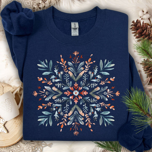 Navy Gildan fleece sweatshirt with a watercolor Nordic snowflake design in red and blue.