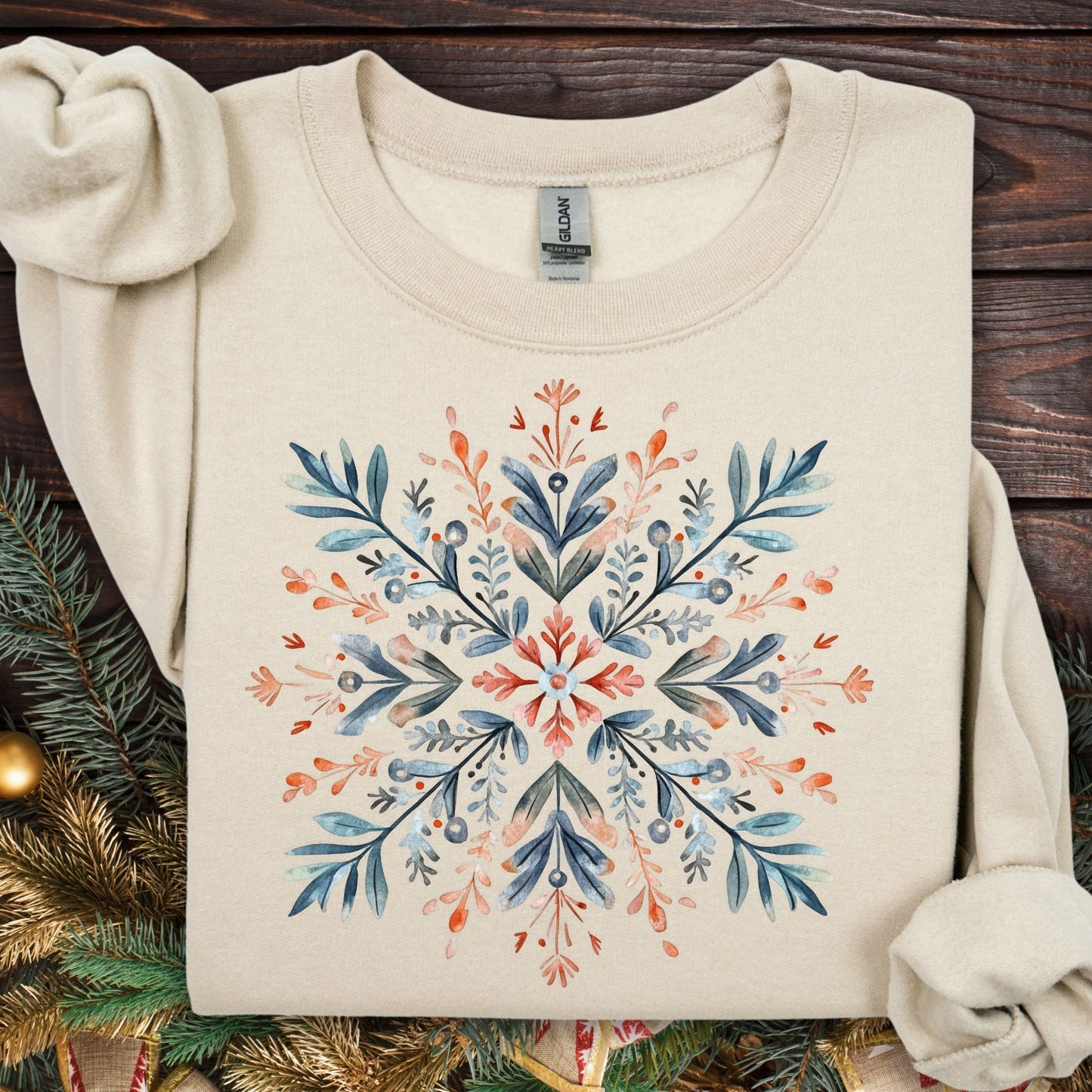 Sand Gildan fleece sweatshirt with a red and blue watercolor Nordic snowflake design.