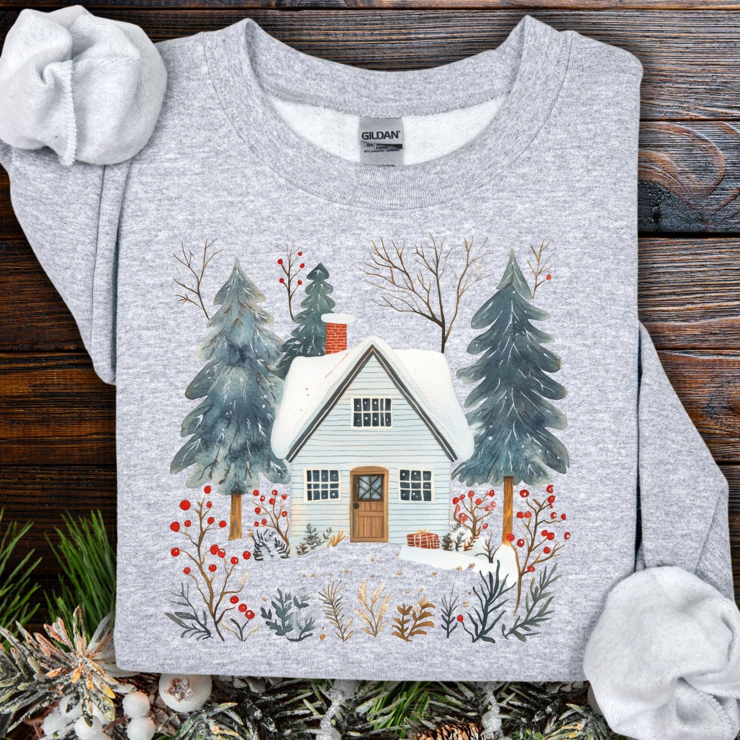 Sport Grey crewneck sweatshirt with a snowy Nordic cabin and pine trees design.
