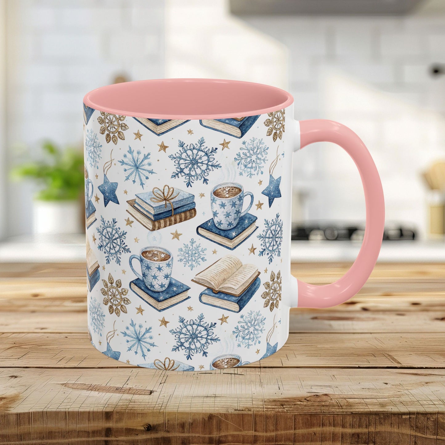 11oz ceramic mug with pink handle/interior, featuring a Nordic winter watercolor of cocoa, books, and snowflakes.