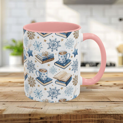 11oz ceramic mug with pink handle/interior, featuring a Nordic winter watercolor of cocoa, books, and snowflakes.