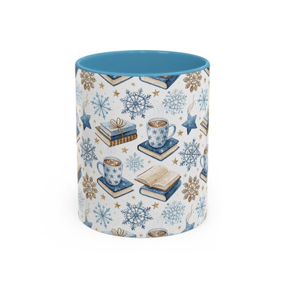 Nordic Winter Cocoa & Books ceramic mug with blue interior, featuring watercolor snowflakes, stars, and stacked books.