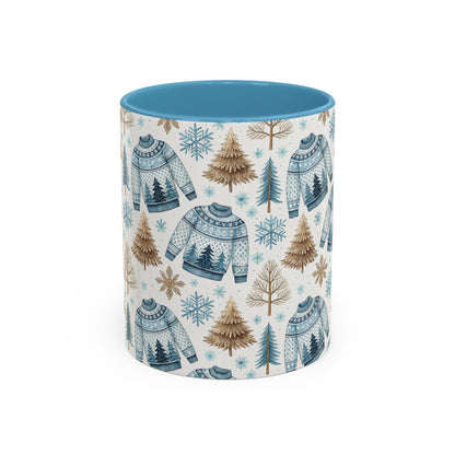 Nordic Winter Fair Isle sweater mug with blue interior, snowflakes, evergreens, and trees.