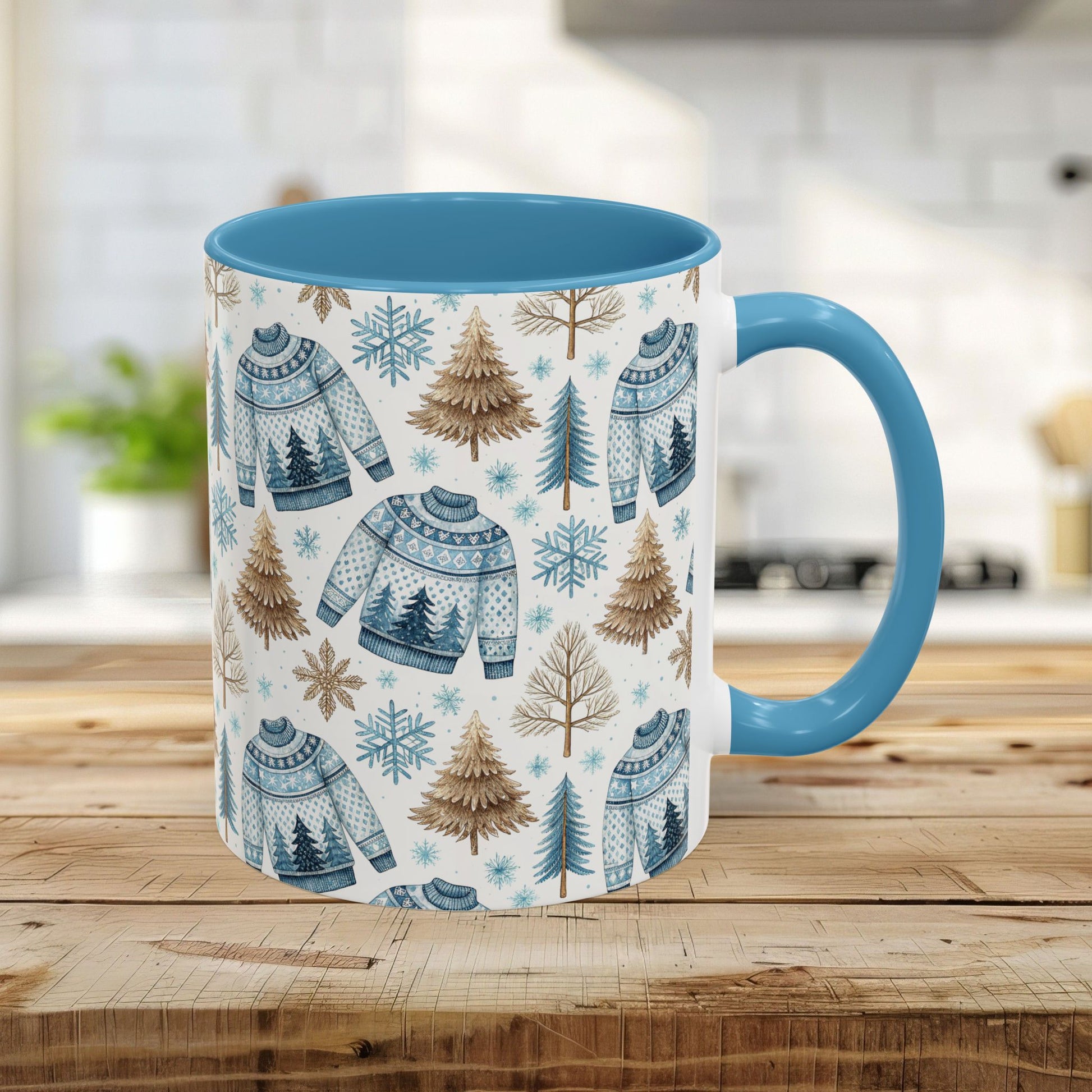 11oz Nordic Winter Fair Isle mug with blue handle & interior, featuring watercolor sweaters, snowflakes, and evergreens.