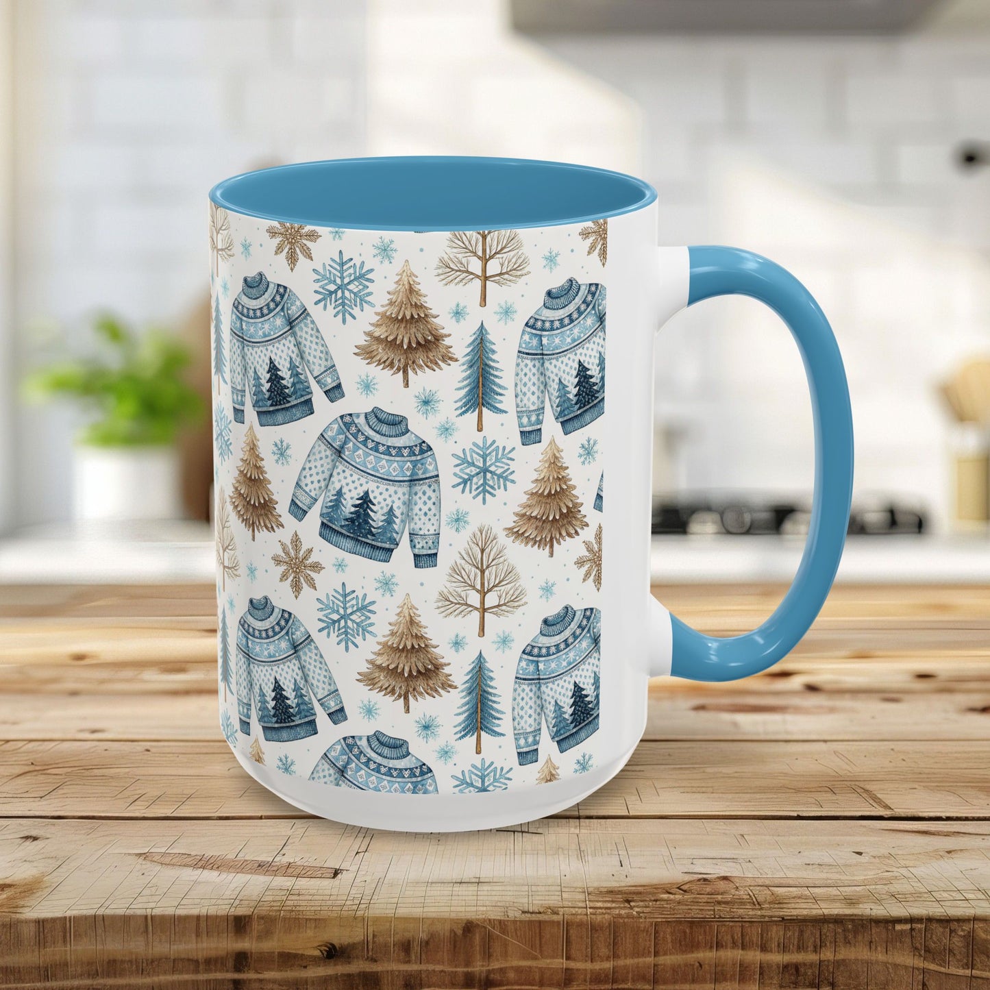 15oz ceramic mug with light blue handle and interior, featuring a watercolor Nordic fair isle sweater, snowflake, and evergreen pattern.