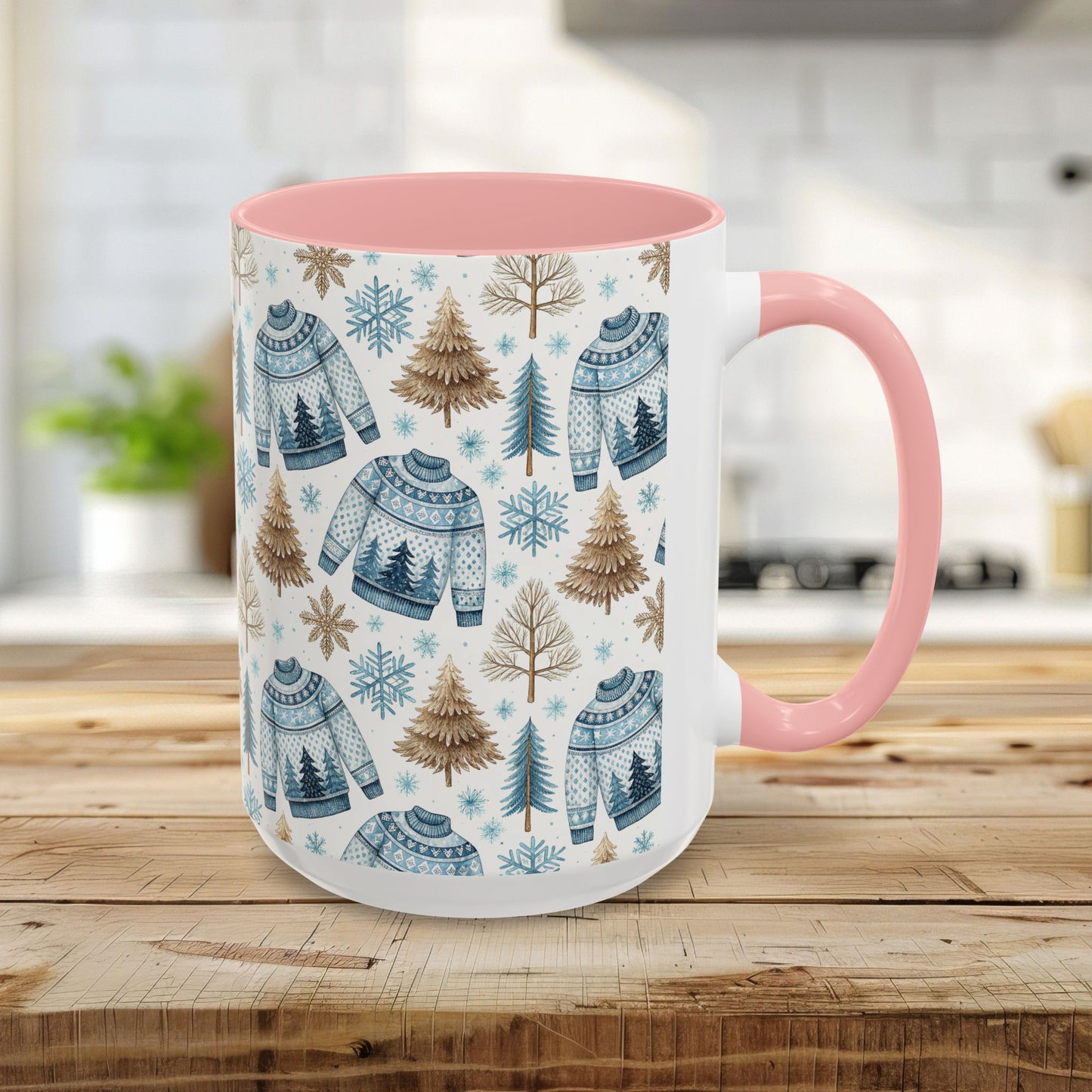 15oz Nordic Winter Fair Isle mug with blue sweaters, snowflakes, and evergreens, pink handle and interior.