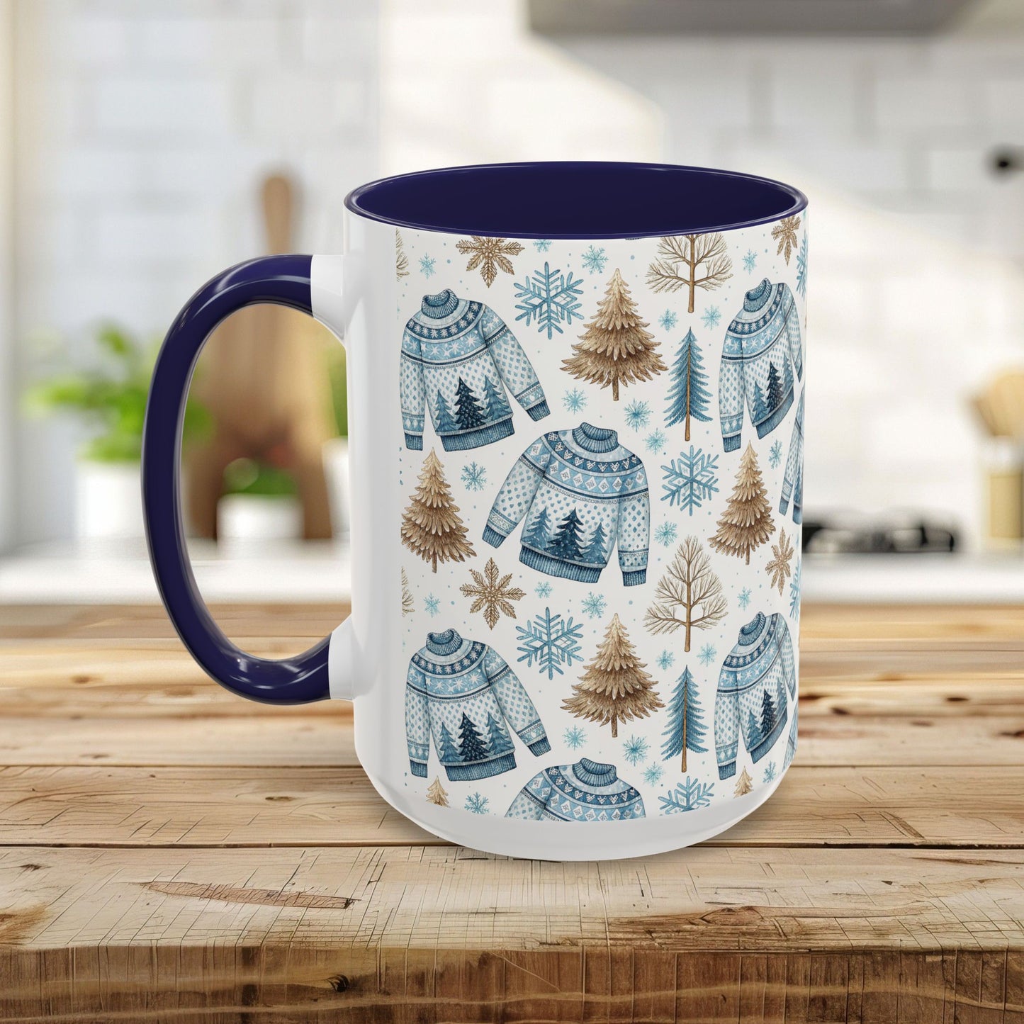 White ceramic mug with blue handle and interior, featuring a watercolor Nordic fair isle sweater and evergreen tree pattern.