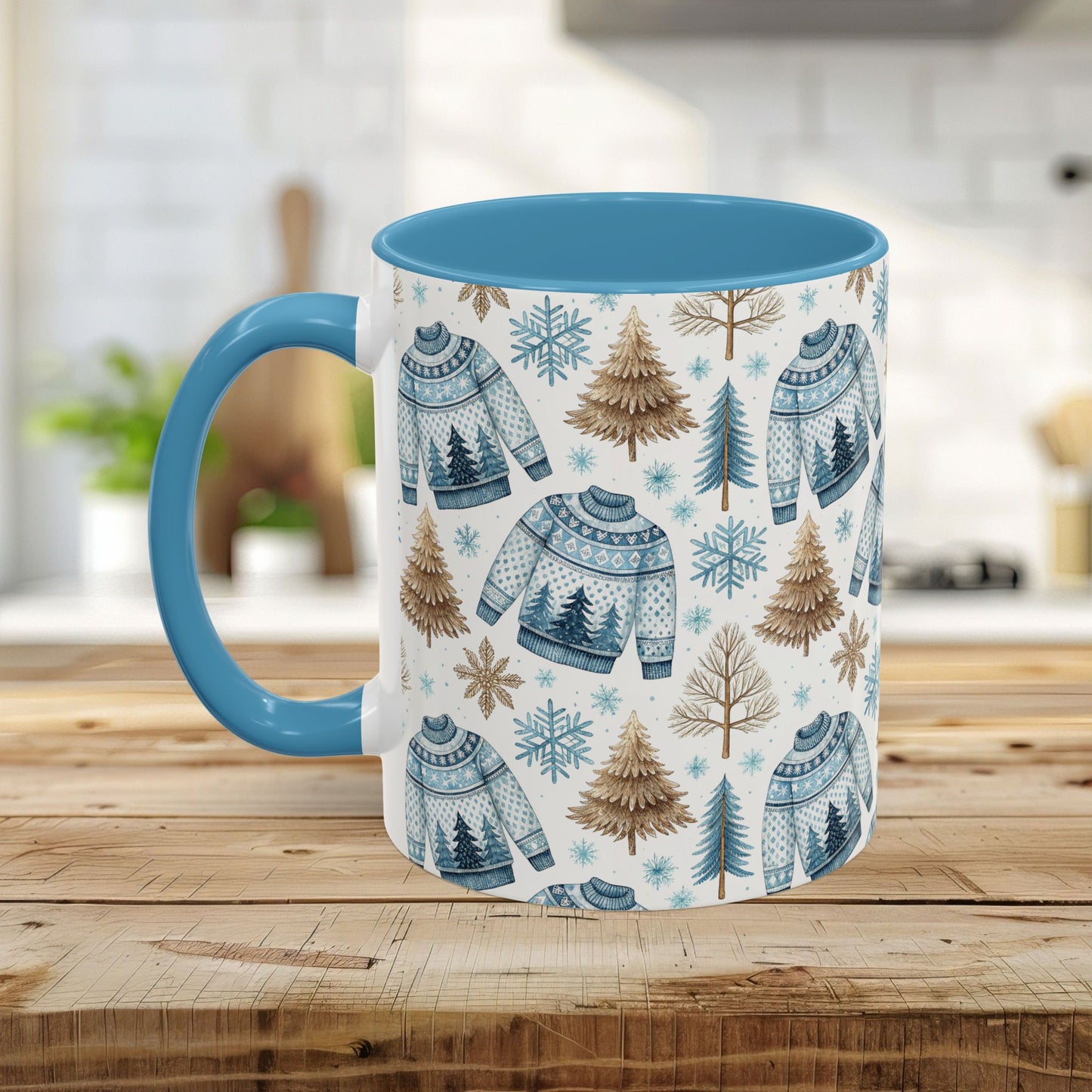 Nordic Winter Fair Isle Sweater mug with blue handle and interior, featuring watercolor snowflakes, evergreens, and sweaters.