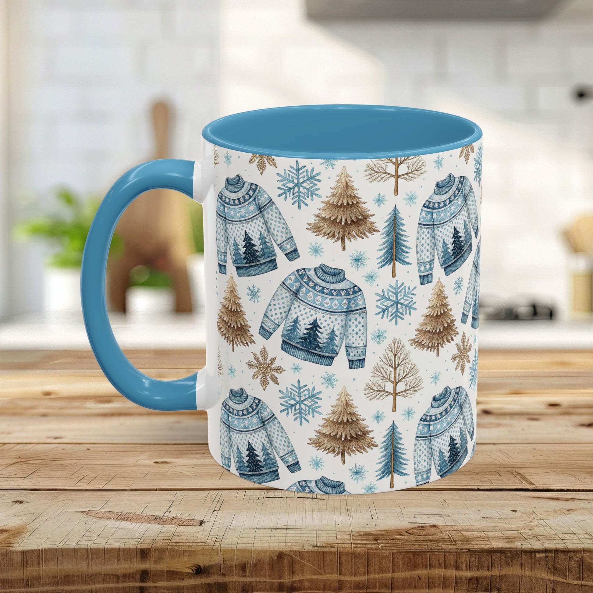 Nordic Winter Fair Isle Sweater mug with blue handle and interior, featuring watercolor snowflakes, evergreens, and sweaters.