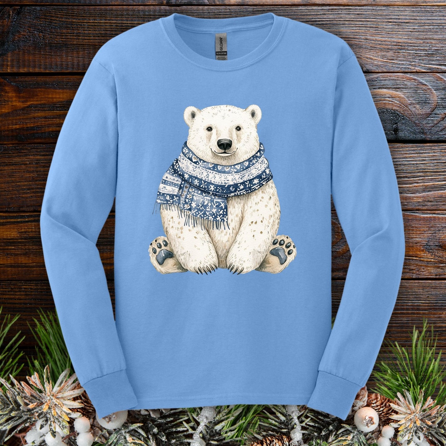 Carolina Blue long-sleeve tee with a hand-painted polar bear wearing a blue knitted scarf.