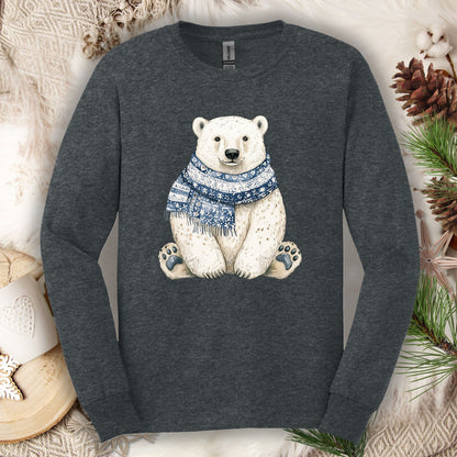 Dark Heather long-sleeve tee with a hand-painted polar bear wearing a blue knitted scarf, surrounded by winter decor.