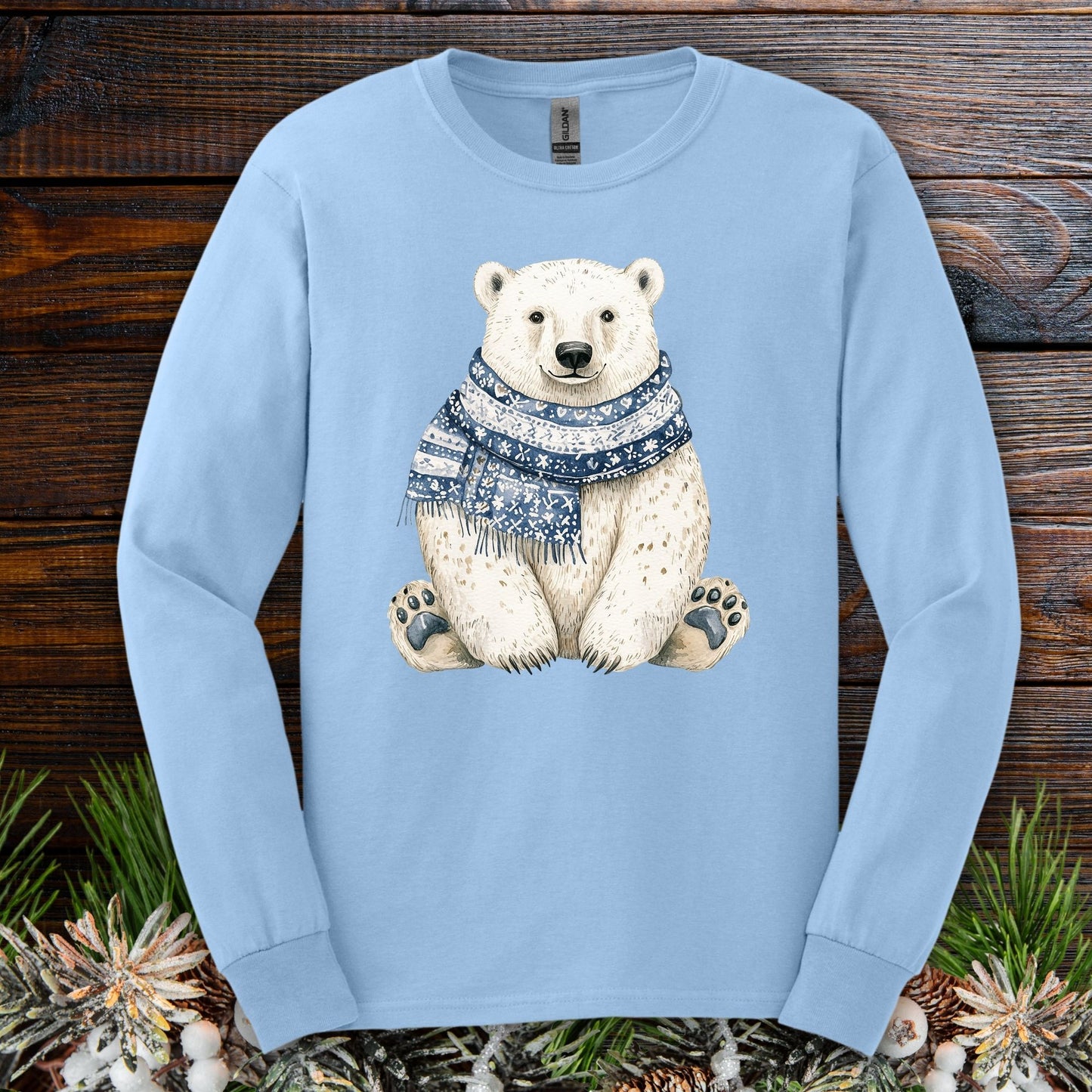 Light blue long-sleeve cotton tee with a hand-painted polar bear wearing a blue and white knitted scarf.