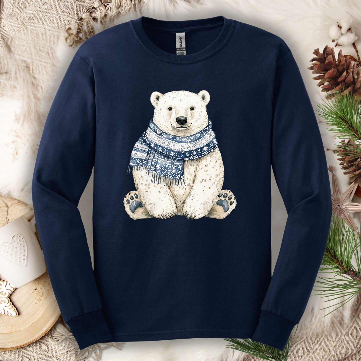 Navy long-sleeve cotton tee with a hand-painted polar bear wearing a blue knitted scarf.