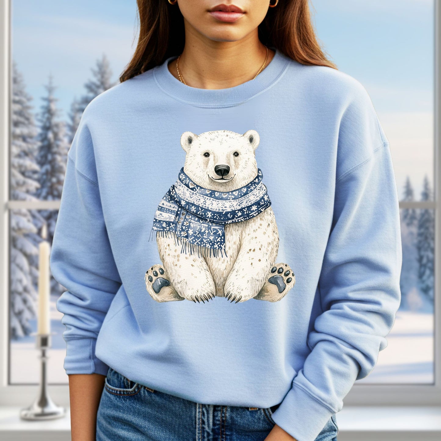Light blue sweatshirt with a sitting polar bear wearing a blue and white patterned scarf.
