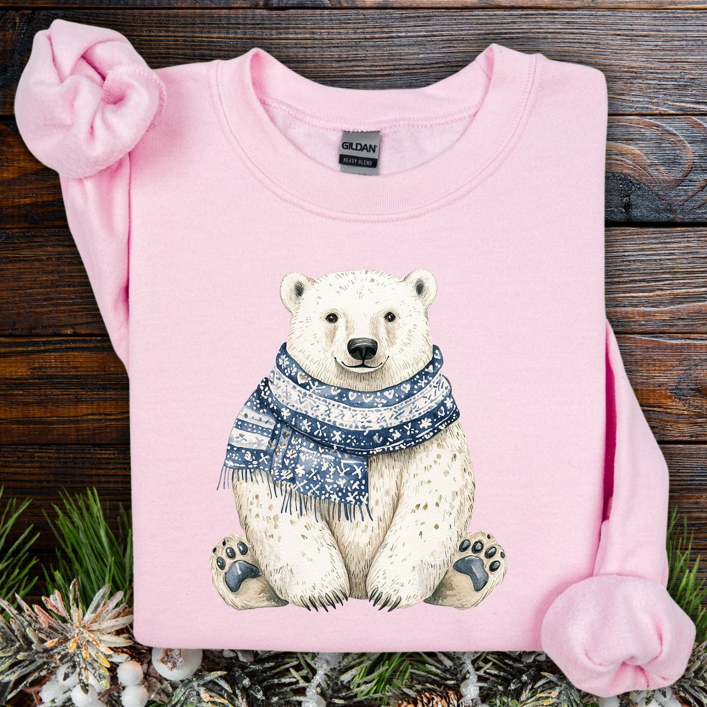 Light pink Nordic Winter Polar Bear Sweatshirt with a detailed polar bear wearing a blue patterned scarf.