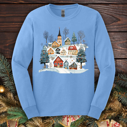 Carolina Blue Gildan Softstyle long sleeve tee with a watercolor Nordic winter village design.