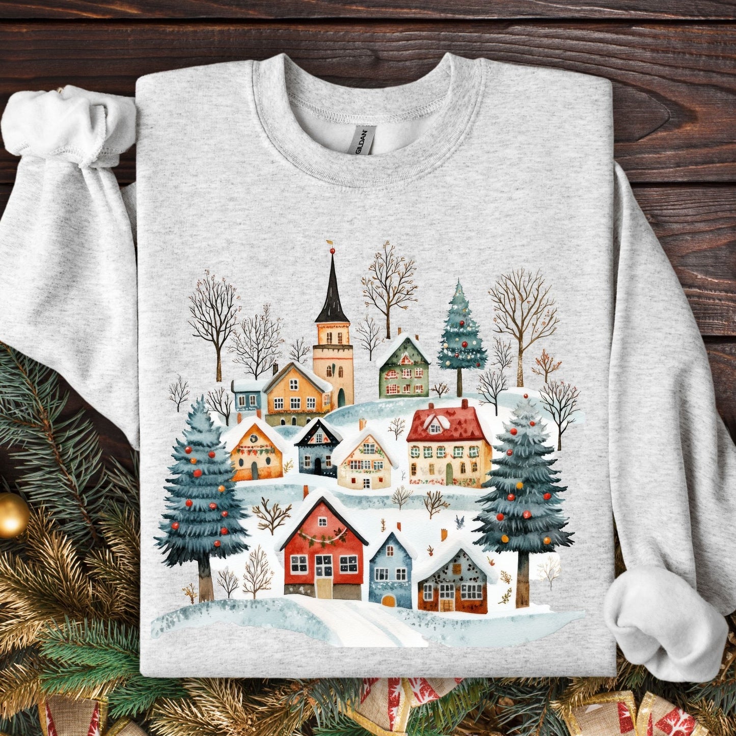 Ash gray unisex sweatshirt with a folk-art Nordic winter village design and Christmas trees.