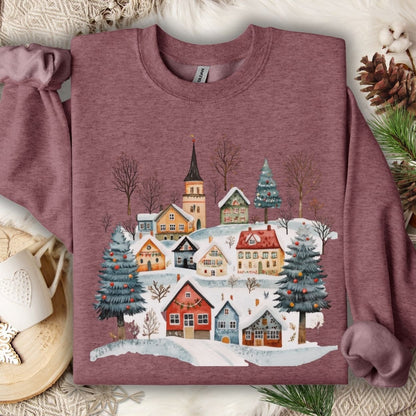 Heather Sport Dark Maroon Nordic Winter Village Sweatshirt with folk-art design of snow-covered cottages and trees.
