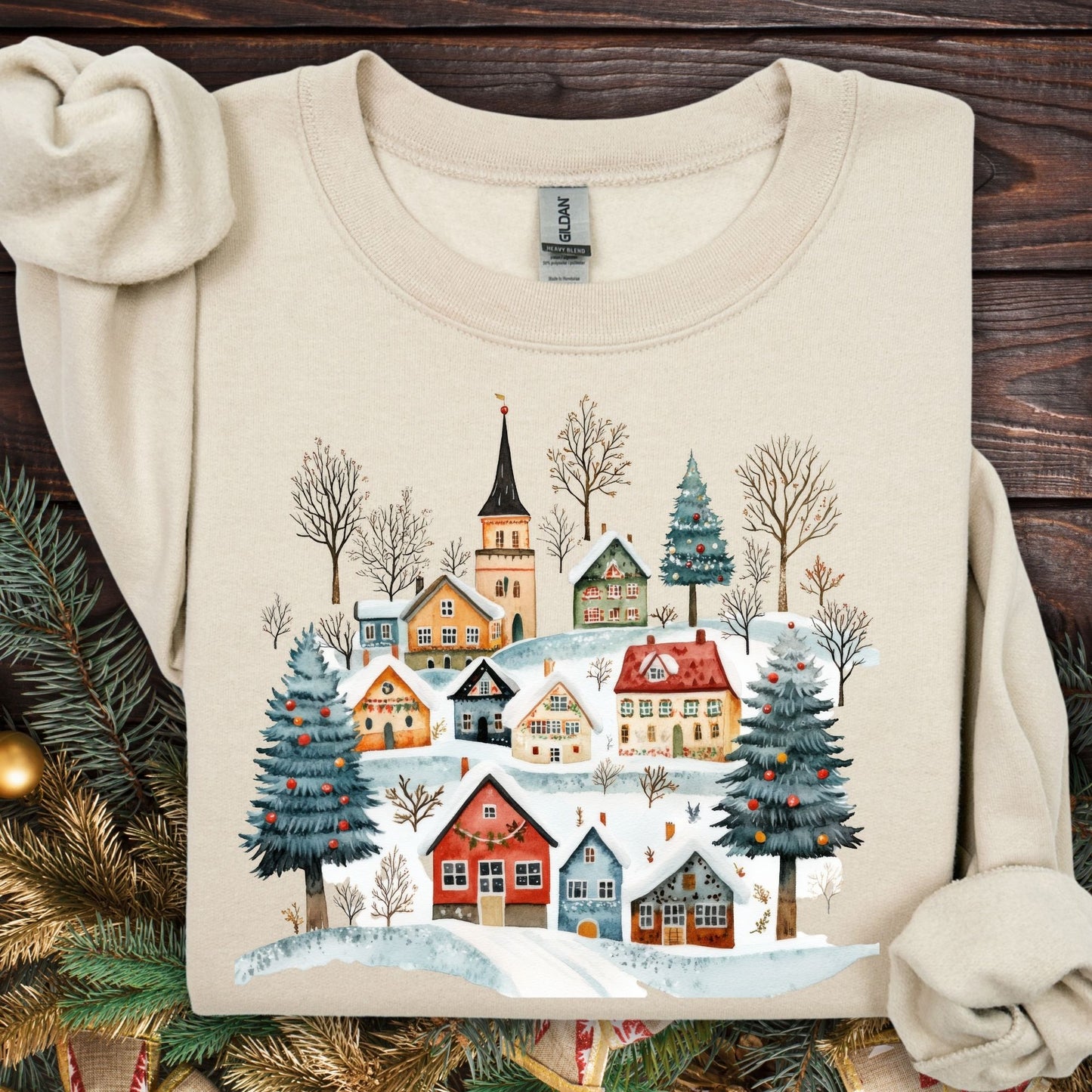 Sand Nordic Winter Village Sweatshirt, S, featuring folk-art cottages, snowy trees, and a church.