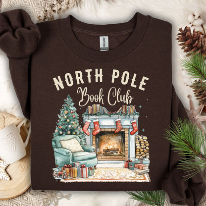 Dark Chocolate North Pole Book Club sweatshirt, S, with a cozy fireside, tree, and books design.