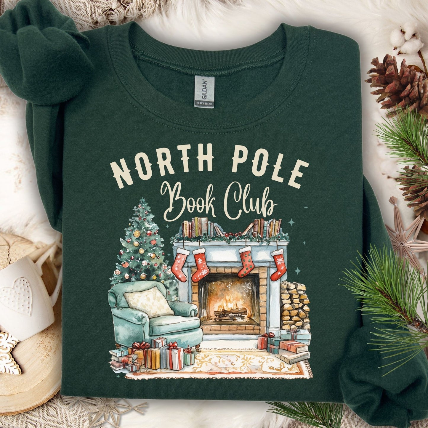 Forest Green North Pole Book Club sweatshirt with a cozy fireside Christmas scene design.