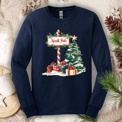 Navy long sleeve tee with a watercolor North Pole sign, Christmas tree, and gifts design.