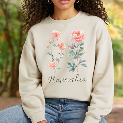 Beige unisex sweatshirt with watercolor chrysanthemum and peony flowers, plus "November" text.