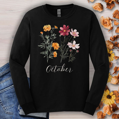 Black long sleeve tee with watercolor marigold and cosmos flowers and "October" text on the chest.