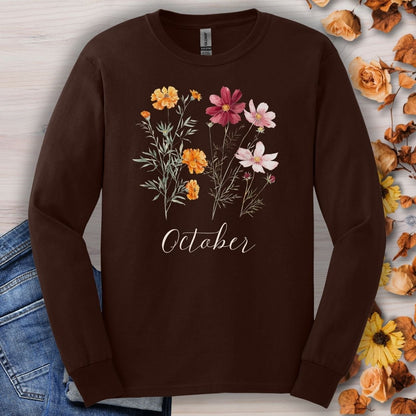 Dark chocolate long sleeve tee with watercolor marigolds, cosmos, and "October" script.