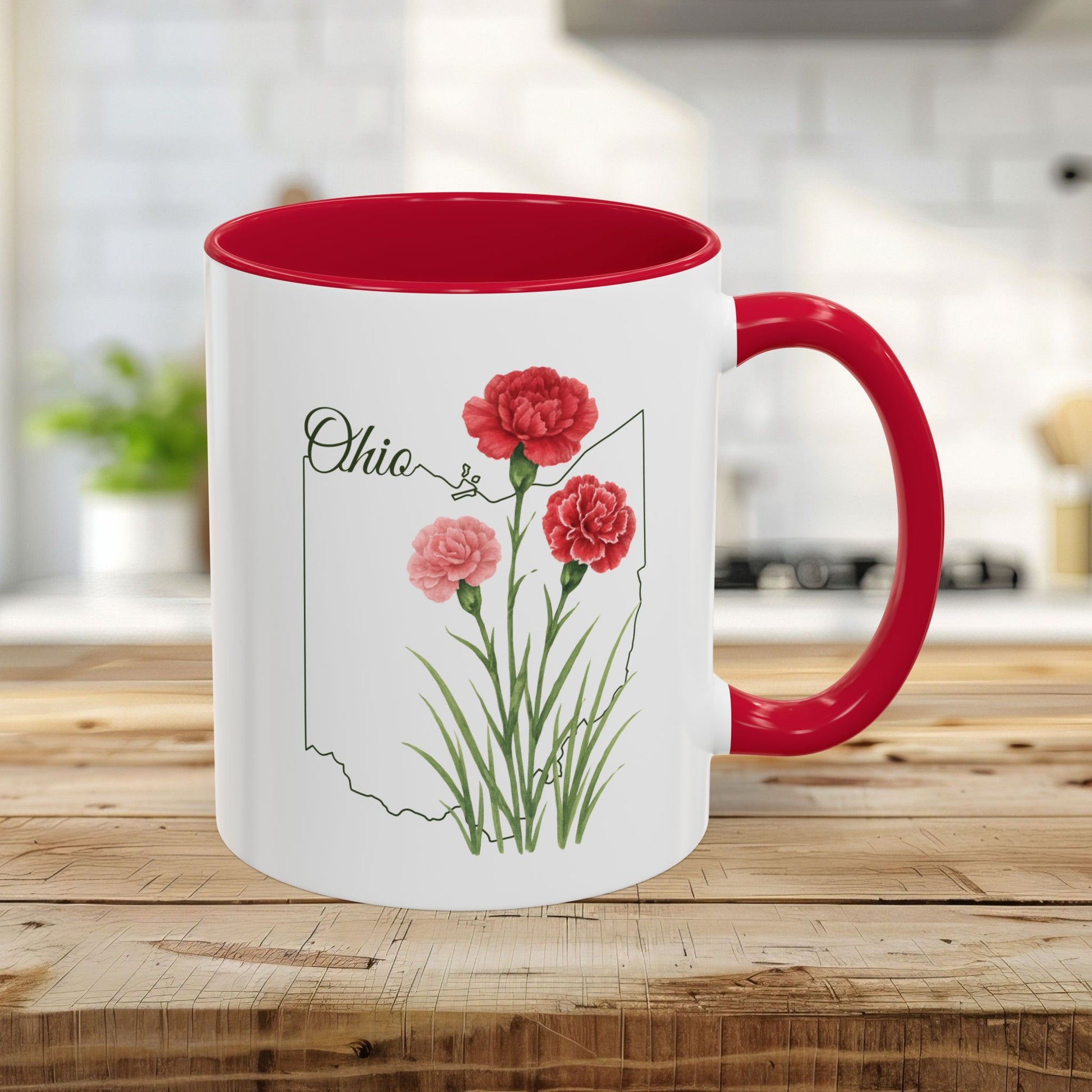 White ceramic mug with red interior and handle, featuring watercolor scarlet carnations over an Ohio state outline.