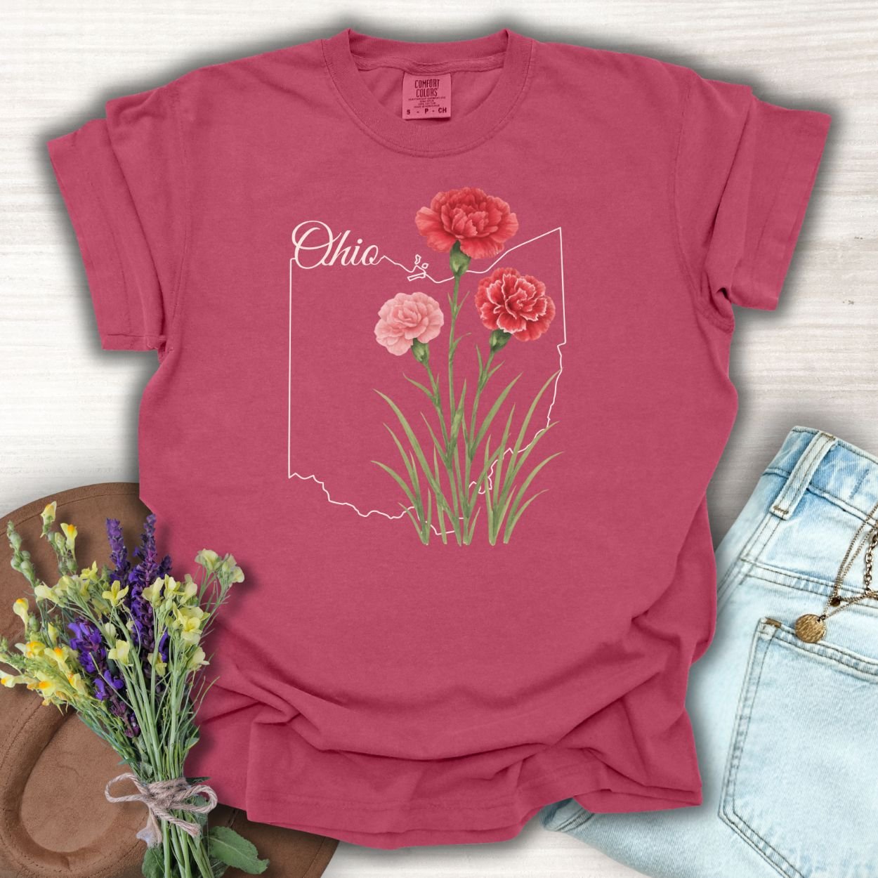 Brick red Ohio State Flower T-shirt with scarlet and pink carnations over an Ohio outline.
