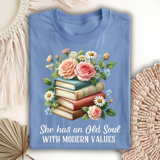 Carolina Blue S t-shirt with watercolor books, pink roses, and "She has an Old Soul WITH MODERN VALUES" text.