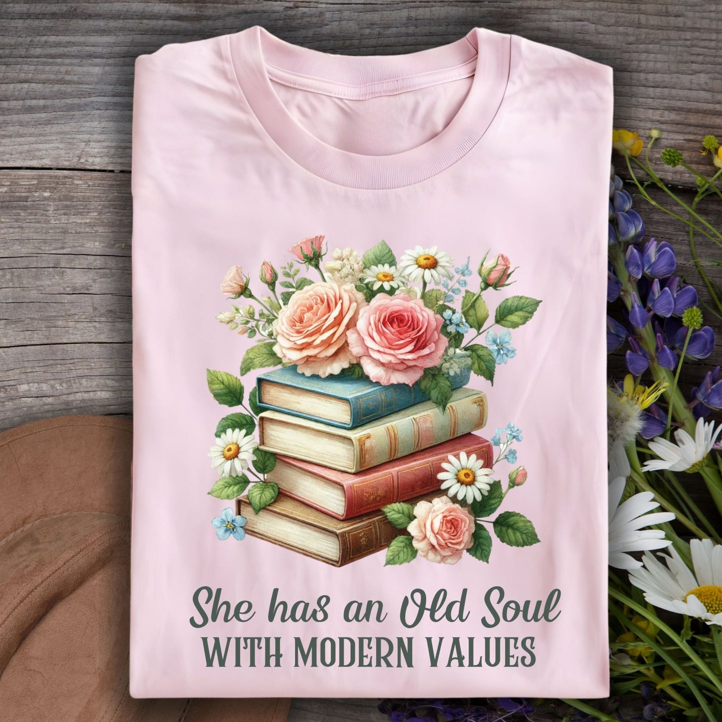 Light pink S t-shirt with watercolor books, roses, and "Old Soul with Modern Values" text.