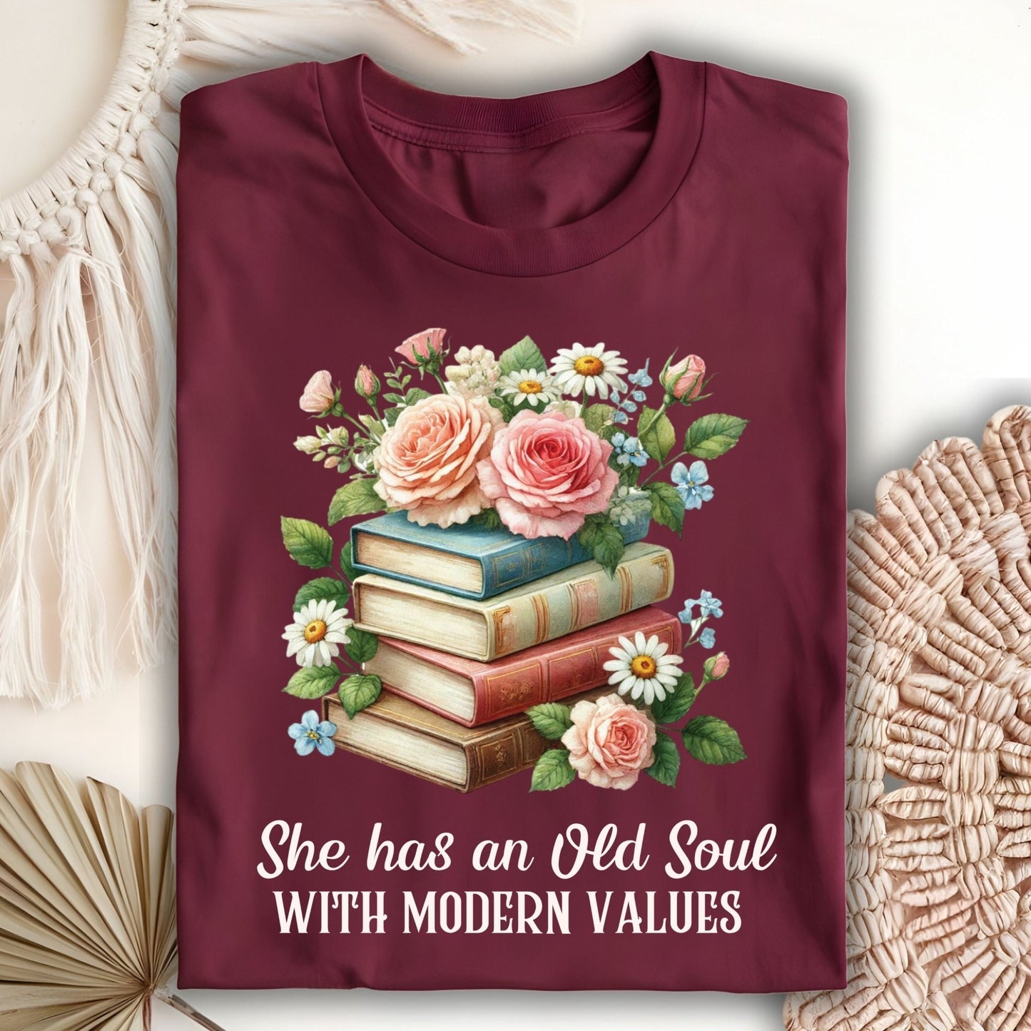 Maroon S t-shirt with watercolor books, roses, and "She has an Old Soul With Modern Values" text.