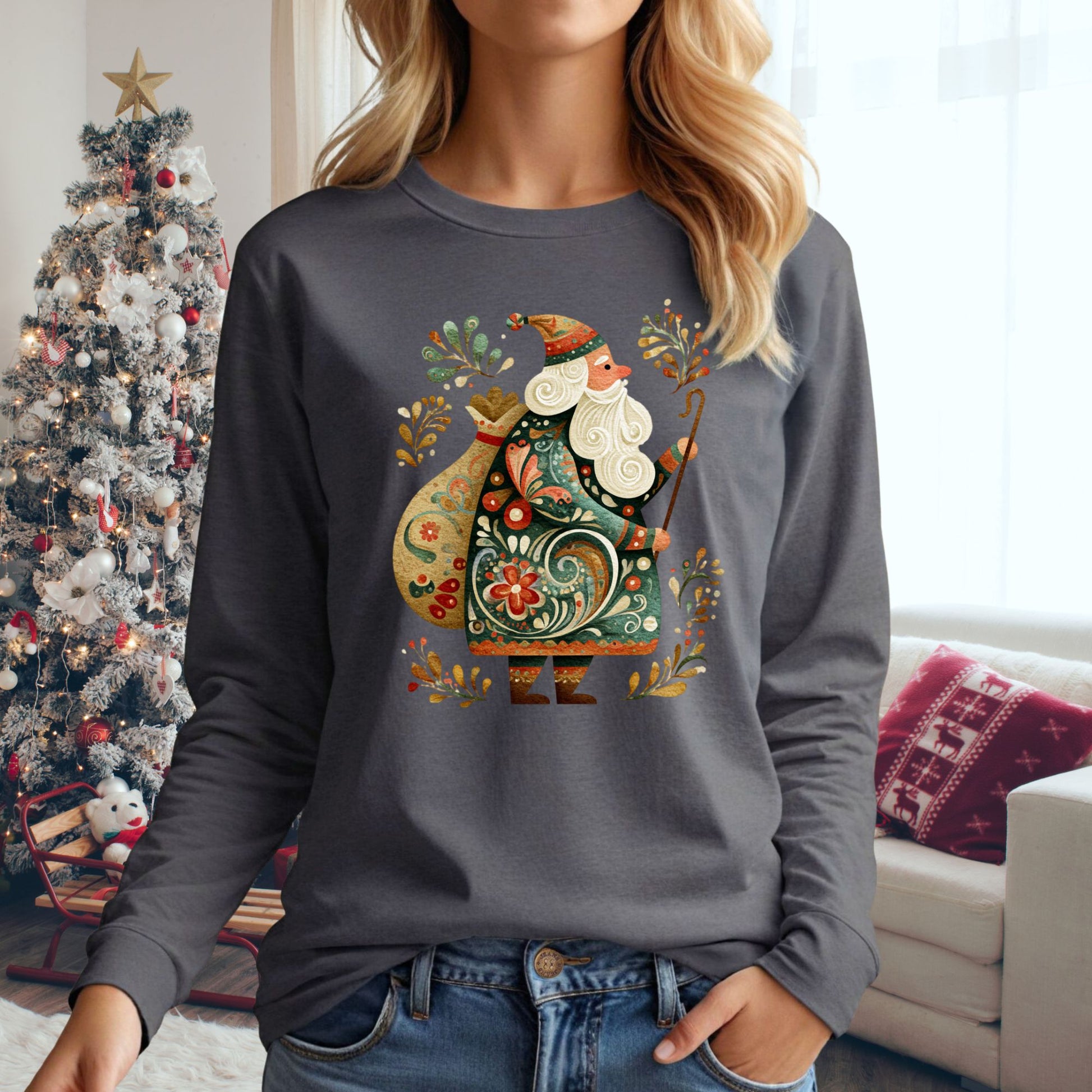 Woman wearing a charcoal long sleeve tee with an ornate Old World St. Nicholas design.