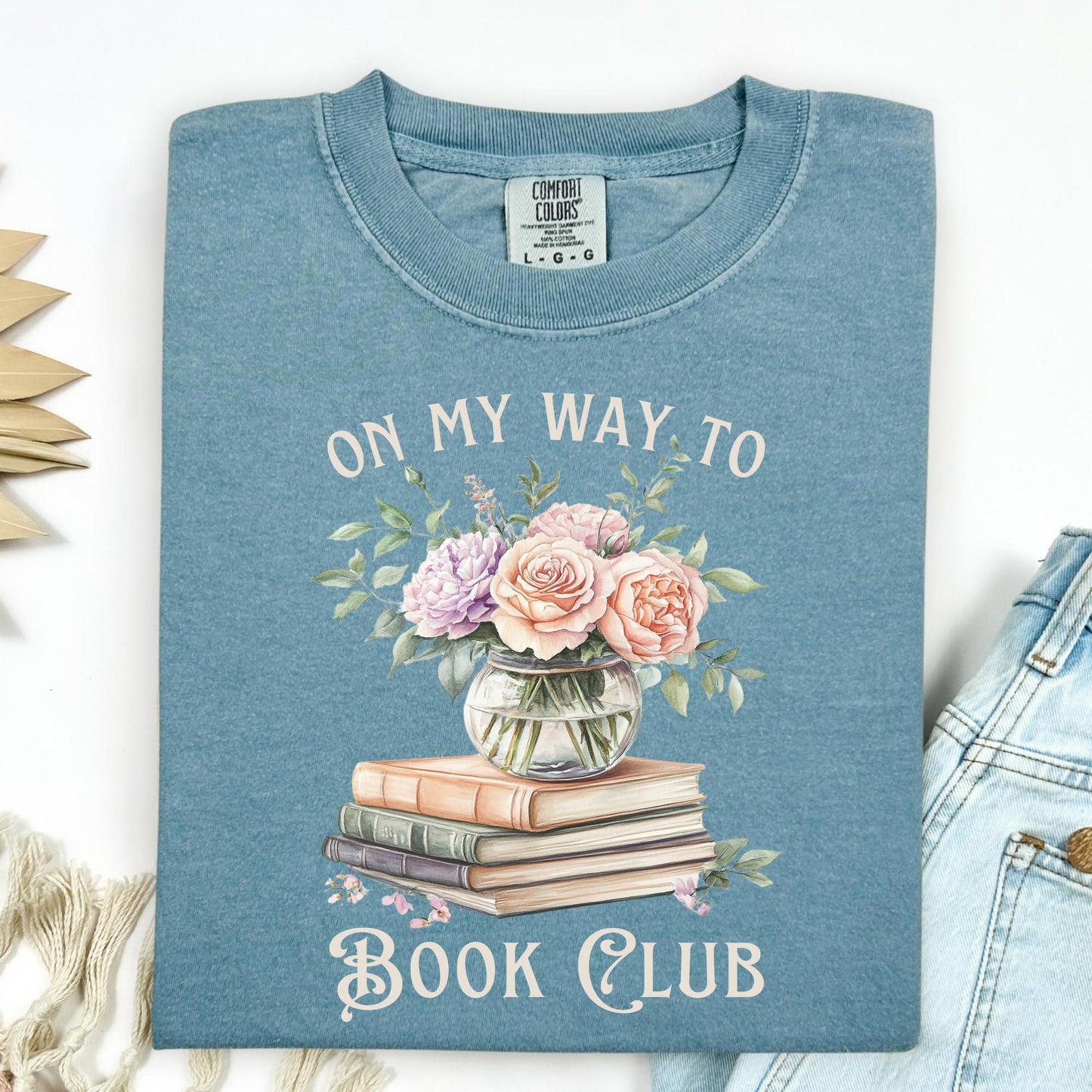 Ice Blue Comfort Colors tee with "On My Way To Book Club" text, watercolor books, and floral vase design.