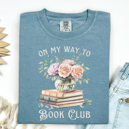 Ice Blue Comfort Colors tee with "On My Way To Book Club" text, watercolor books, and floral vase design.