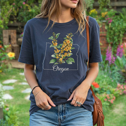 Relaxed-fit, garment-dyed navy t-shirt with a white Oregon outline and yellow Oregon Grape blossoms.