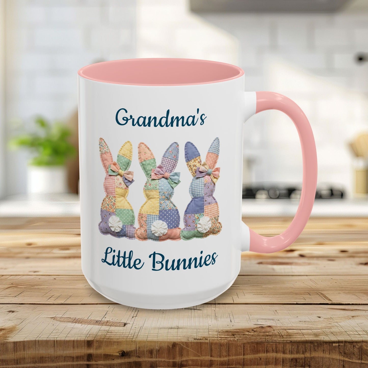 Personalized 15oz ceramic mug with pink handle/interior, "Grandma's Little Bunnies" text, and patchwork bunny design.