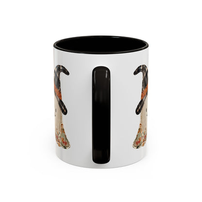 White ceramic mug with black handle and interior, featuring a patchwork ghost in a plaid witch hat.