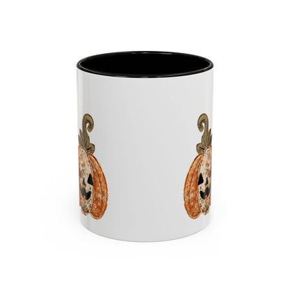 White ceramic mug with black interior and handle, featuring a patchwork Jack O'Lantern design.