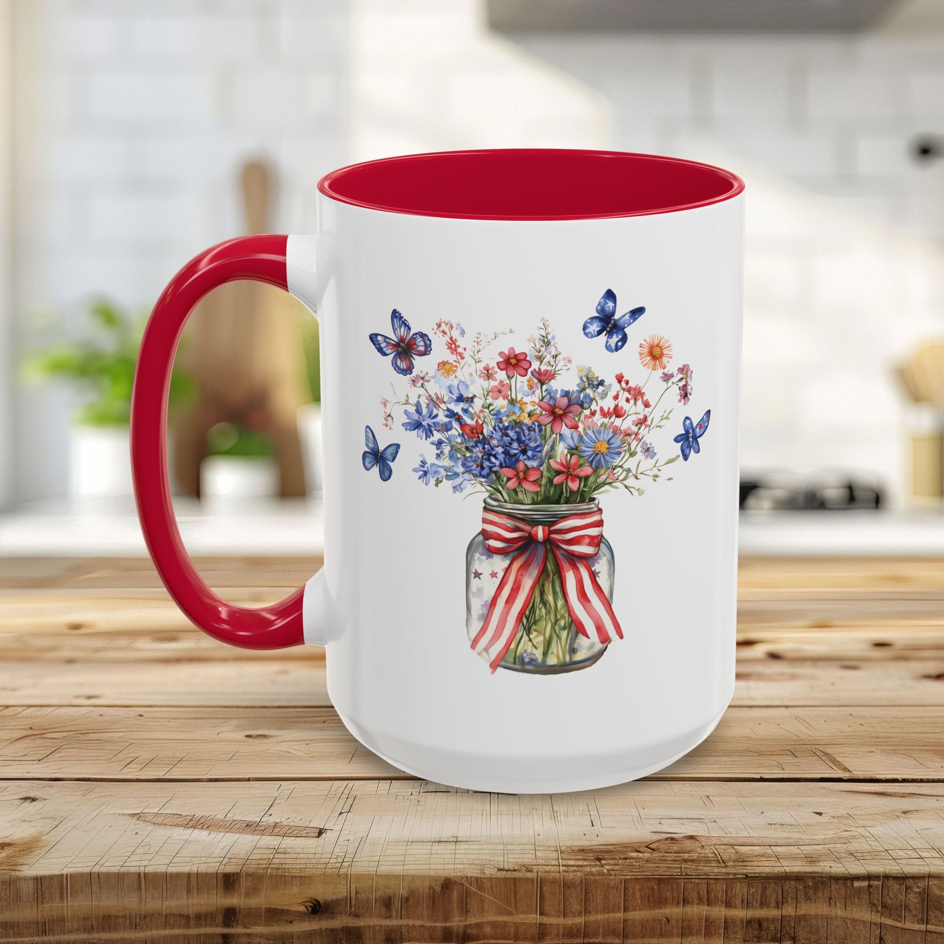 White ceramic mug with red interior and handle, featuring a watercolor mason jar bouquet and blue butterflies.