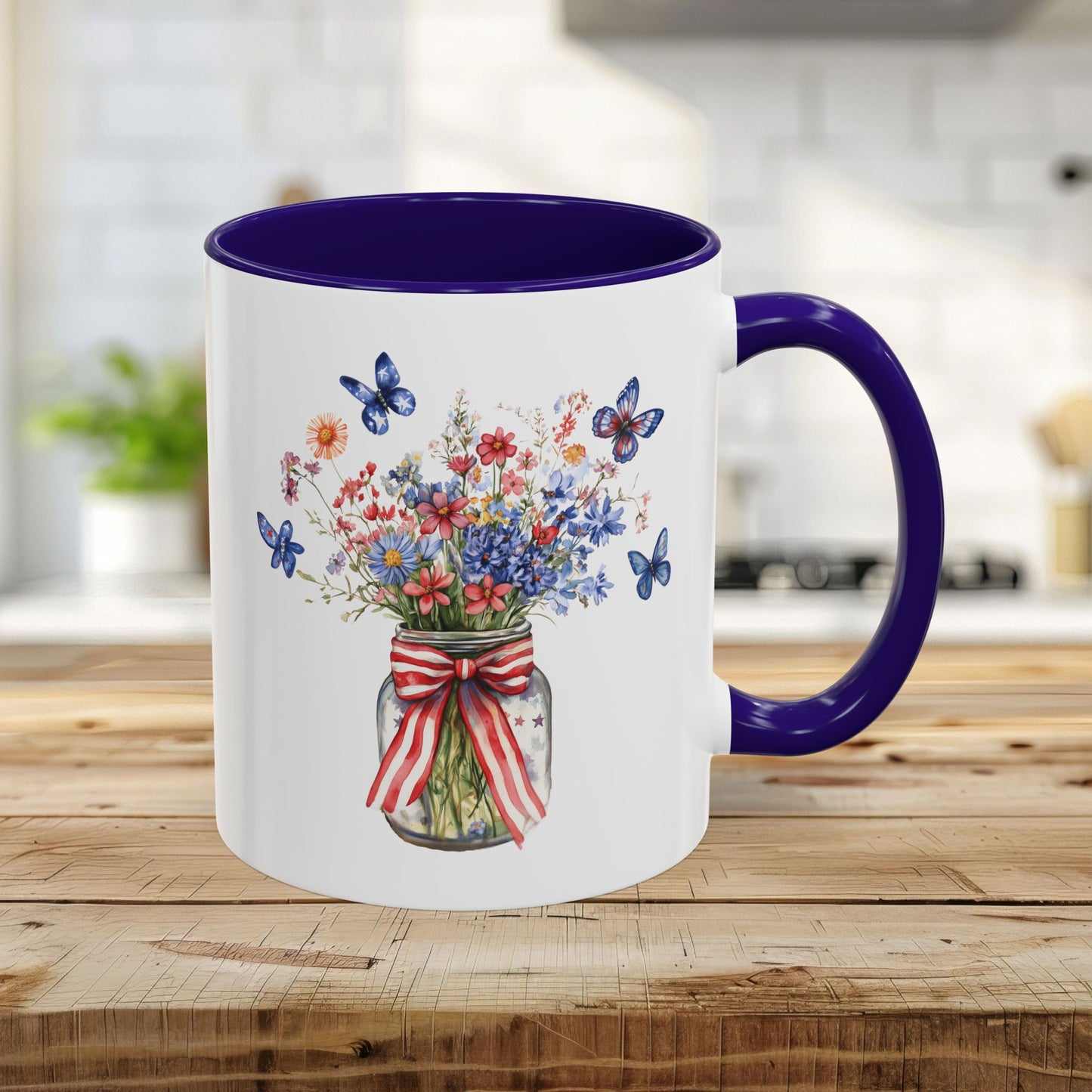 11oz ceramic mug with a blue interior/handle and a watercolor patriotic floral mason jar design.