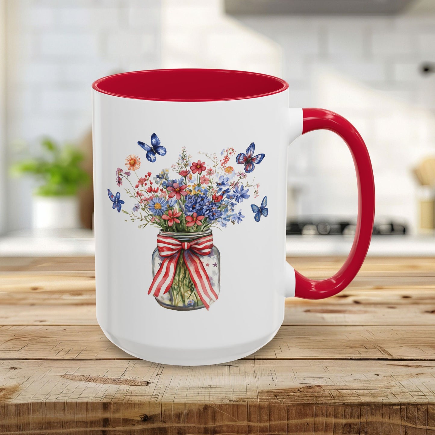 15oz white ceramic mug with red interior/handle, featuring a watercolor mason jar of patriotic flowers and blue butterflies.