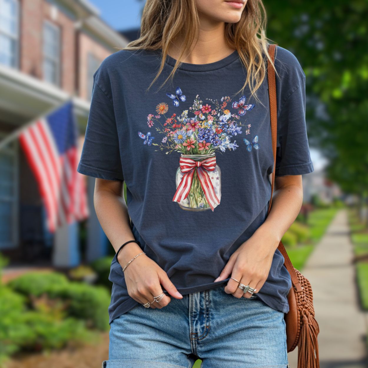 Garment-dyed navy t-shirt with a watercolor mason jar of wildflowers, butterflies, and a patriotic ribbon.