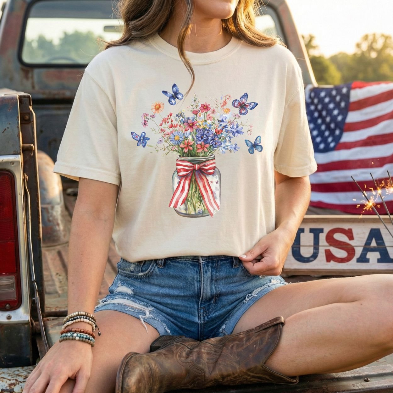Patriotic wildflower bouquet in a mason jar with butterflies on a relaxed-fit, garment-dyed t-shirt.