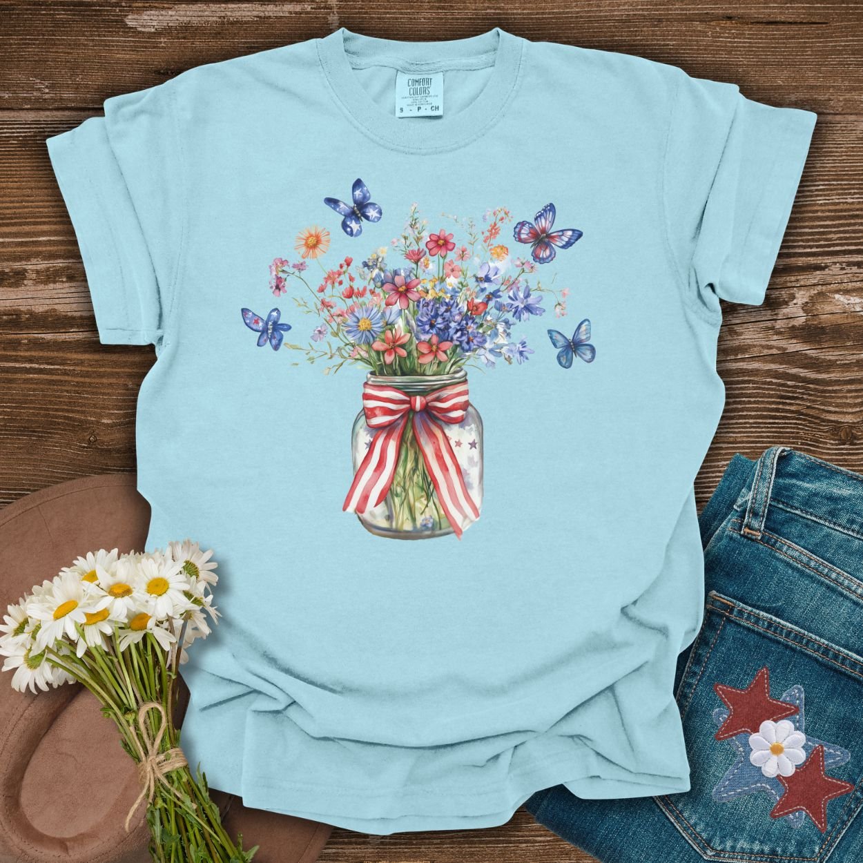 Chambray S t-shirt with a watercolor mason jar of wildflowers, butterflies, and a patriotic ribbon.