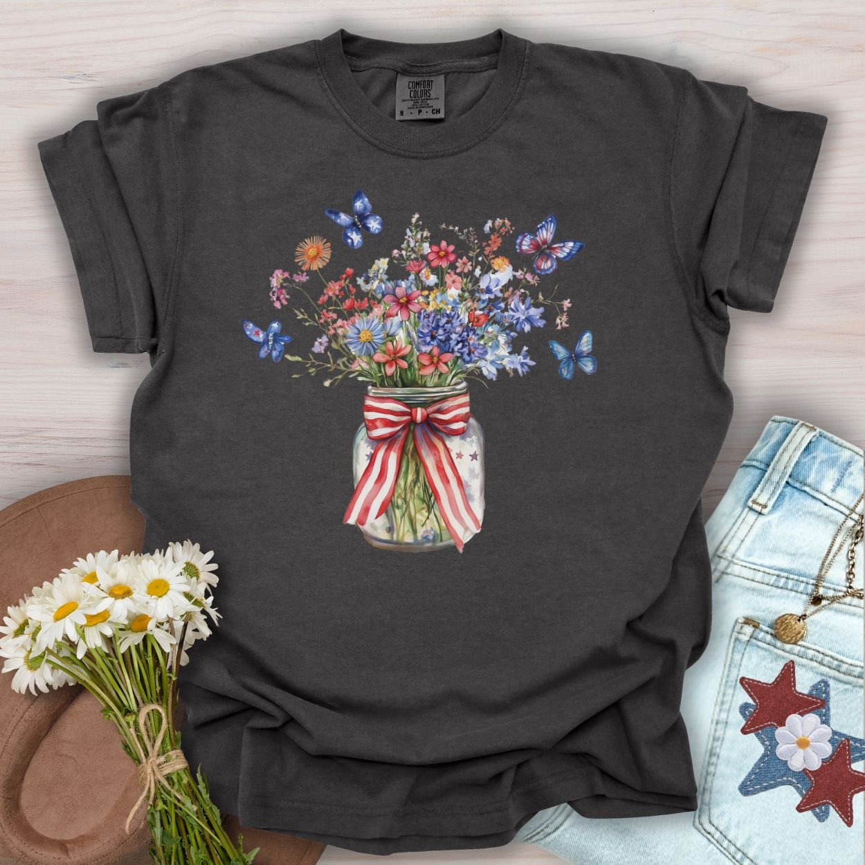 Pepper S t-shirt with watercolor wildflowers in a patriotic mason jar with butterflies.